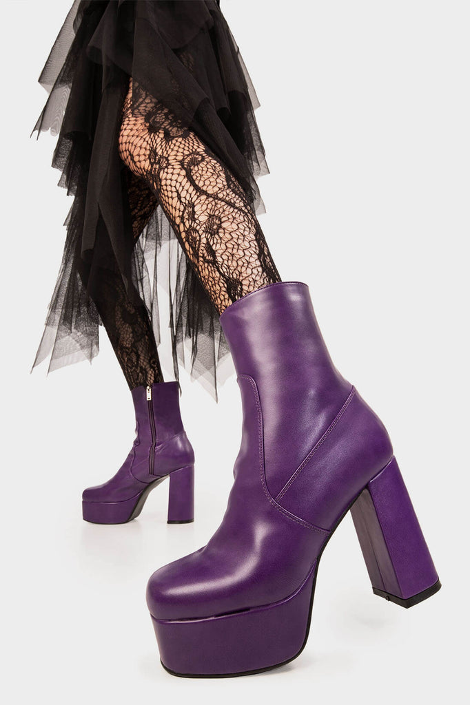 Diva's Delight.
 
 Making Moves Platform Ankle Boots in Purple faux leather. These vegan Platform Ankle boots feature a platform sole to reach new heights in the style game. Made with eco-friendly materials and 100% cruelty-free, these Boots are as ethical as they are delightful!
 
 - Platform Height: 1.25 inch
 - Heel Height: 4.2 inch
 - Purple Zipper
 - High Platform sole
 - Round toe
 - 100% vegan
 
 SKU: LMF 1559 - PurplePU