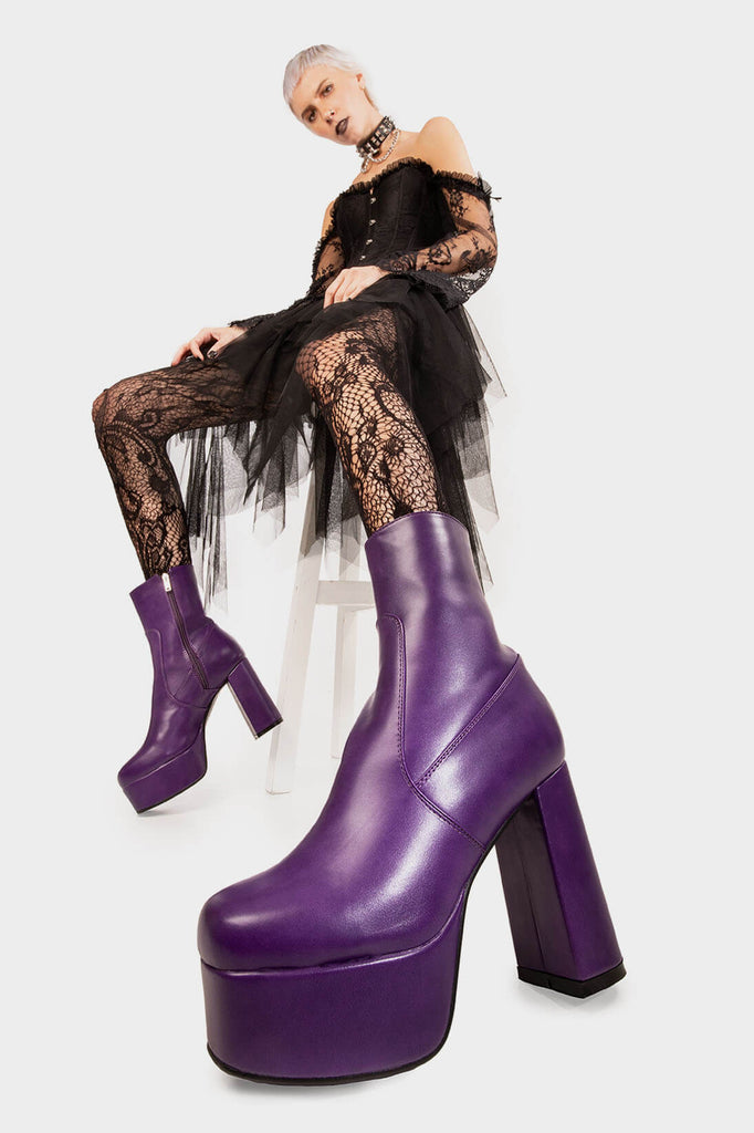 Diva's Delight.
 
 Making Moves Platform Ankle Boots in Purple faux leather. These vegan Platform Ankle boots feature a platform sole to reach new heights in the style game. Made with eco-friendly materials and 100% cruelty-free, these Boots are as ethical as they are delightful!
 
 - Platform Height: 1.25 inch
 - Heel Height: 4.2 inch
 - Purple Zipper
 - High Platform sole
 - Round toe
 - 100% vegan
 
 SKU: LMF 1559 - PurplePU