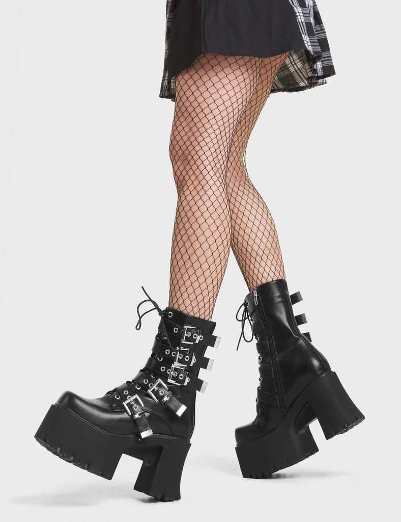 Me Likey Chunky Platform Ankle Boots in Black. These chunky ankle boots feature silver buckles with adjustable straps.