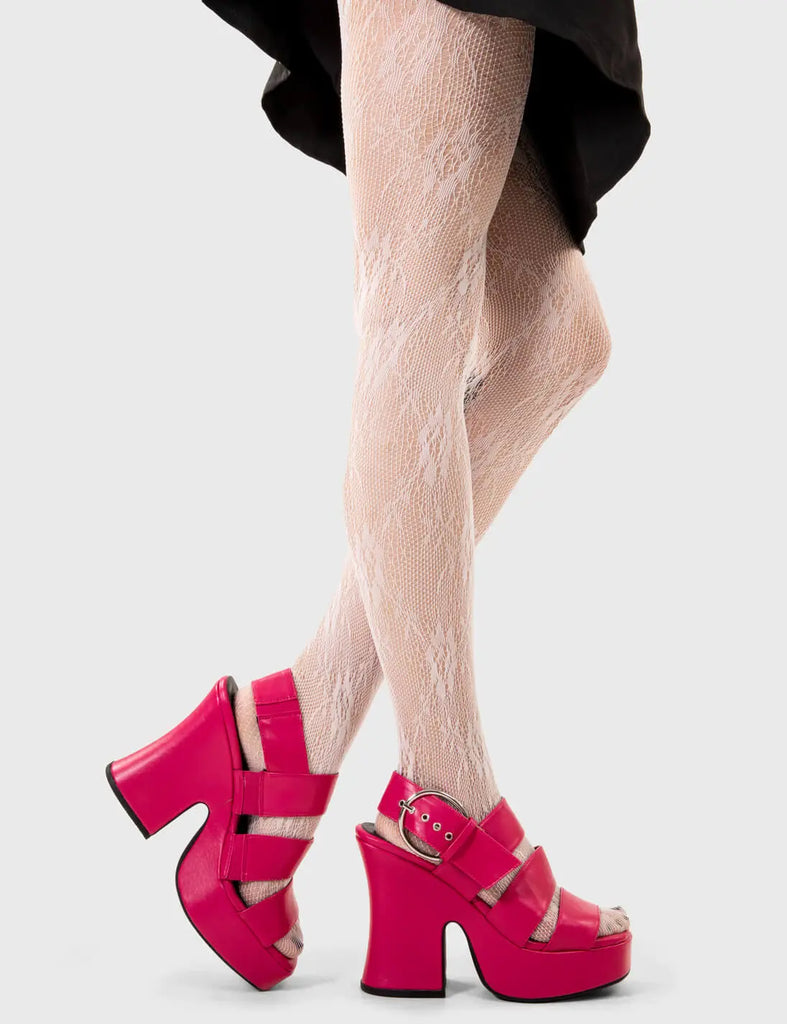 Sun Kissed Steps
 
 Mentally Wired Platform Sandals in Fuchsia. These platform sandals feature three straps across the upper with a adjustable strap across the heel, taste the sweetness of summer with stylish sandals. Made with eco-friendly materials and 100% cruelty-free, these platform boots are as ethical as they are HOT!
 
 - Platform Height
 - Heel Height
 - Adjustable strap
 - Silver eyelets with D shaped buckle
 - Chunky Platform sole
 - Round Toe 
 - 100% vegan 
 
 SKU: LMF 2503 - FuchsiaPU