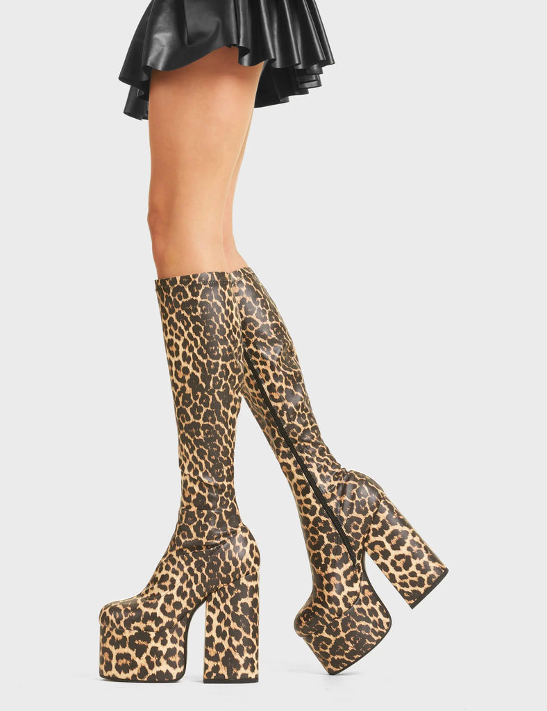 Messenger Platform Knee High Boots in Brown Leopard print. Feature a minimalist design, platform sole and a stretch fit.