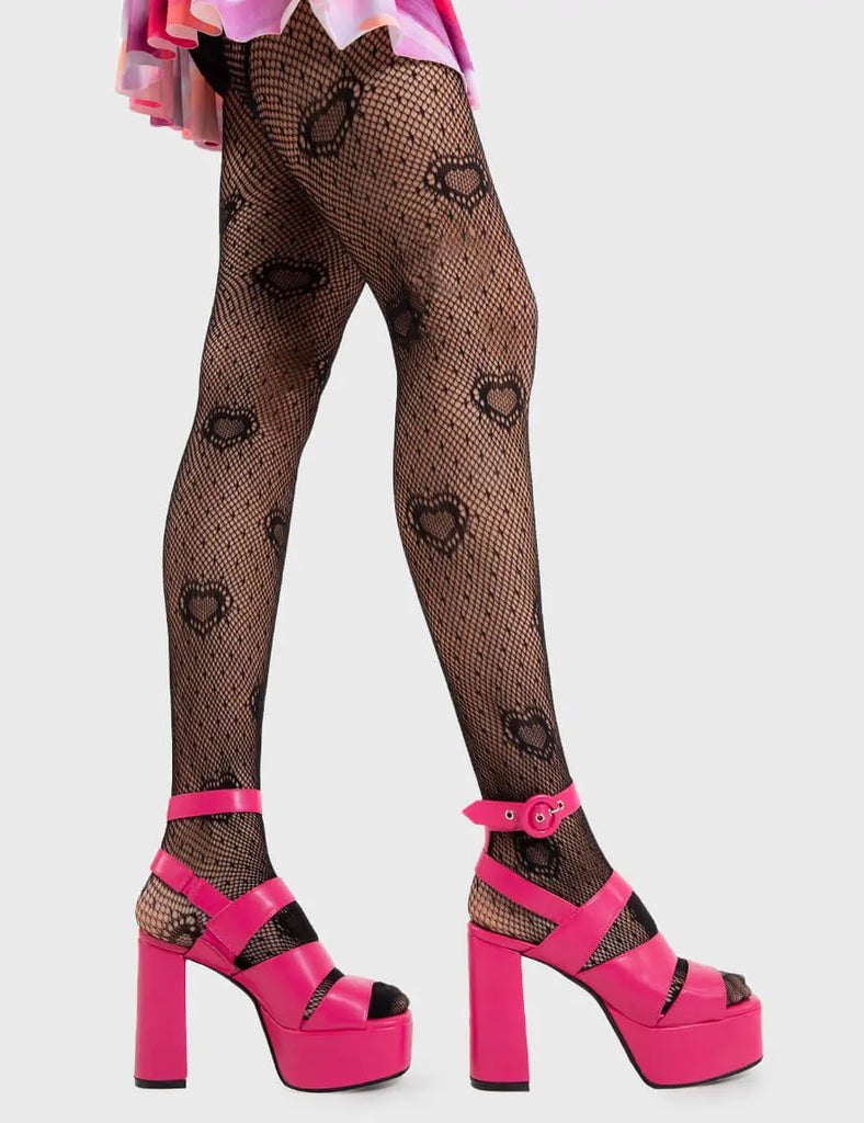 On point !
 
 Millions Platform Sandals in Fuchsia faux leather. These fuchsia Sandals feature an open toe and cut out details as well as a fuchsia adjustable ankle strap with silver eyelets and 'O' ring shaped buckles, strap up and elevate your style. Made with eco-friendly materials and 100% cruelty-free !
 
 - Platform Height
 - Heel Height
 - Fuchsia adjustable strap 
 - Silver eyelets and 'O' ring shaped buckles
 - Chunky platform sole
 - Square Toe 
 - 100% vegan 
 
 SKU: LMF 2310 - FuchsiaPU - UK3