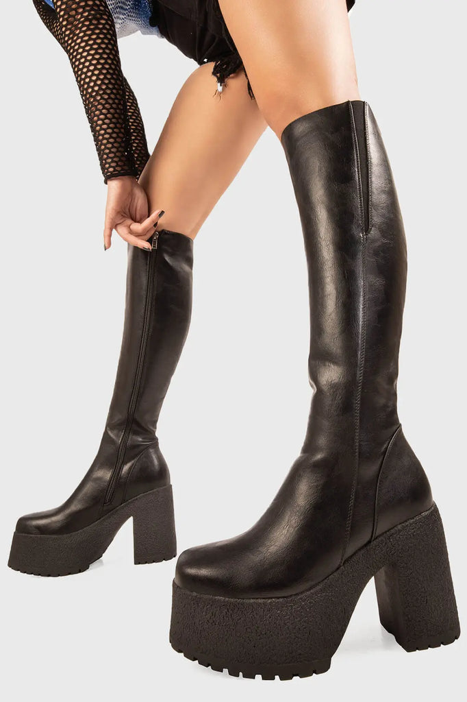 Stomp-a-Licious
 
 Miracle Aligner Platform Knee High Boots in Black faux leather. These Black vegan Platform Boots feature a chunky lightweight sole, stepping into the extraordinary. Made with eco-friendly materials and 100% cruelty-free, these platform boots are as ethical as they are unapologetically sassy!
 
 
 - Platform Height: 1.6 inch
 - Heel Height: 4.4 inch
 - Black Zipper
 - Gusset detail
 - Wide Ankle and Calf Friendly 
 - Chunky sole
 - Round Toe
 - 100% vegan 
 
 SKU: LMF 1824 - BlackPU