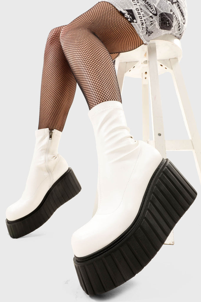 Choas Crushers
 
 Muster Up Chunky Ankle Creeper Boots in White faux leather. These platform boots feature on our creeper sole, crush the limits and break the ordinary. Made with eco-friendly materials and 100% cruelty-free, these platform boots are as ethical as they are Iconic.
 
 - Platform Height
 - Black zipper
 - Mid ankle length
 - Platform sole
 - Round Toe 
 - 100% vegan 
 
 SKU: LMF 2660 - WhitePU