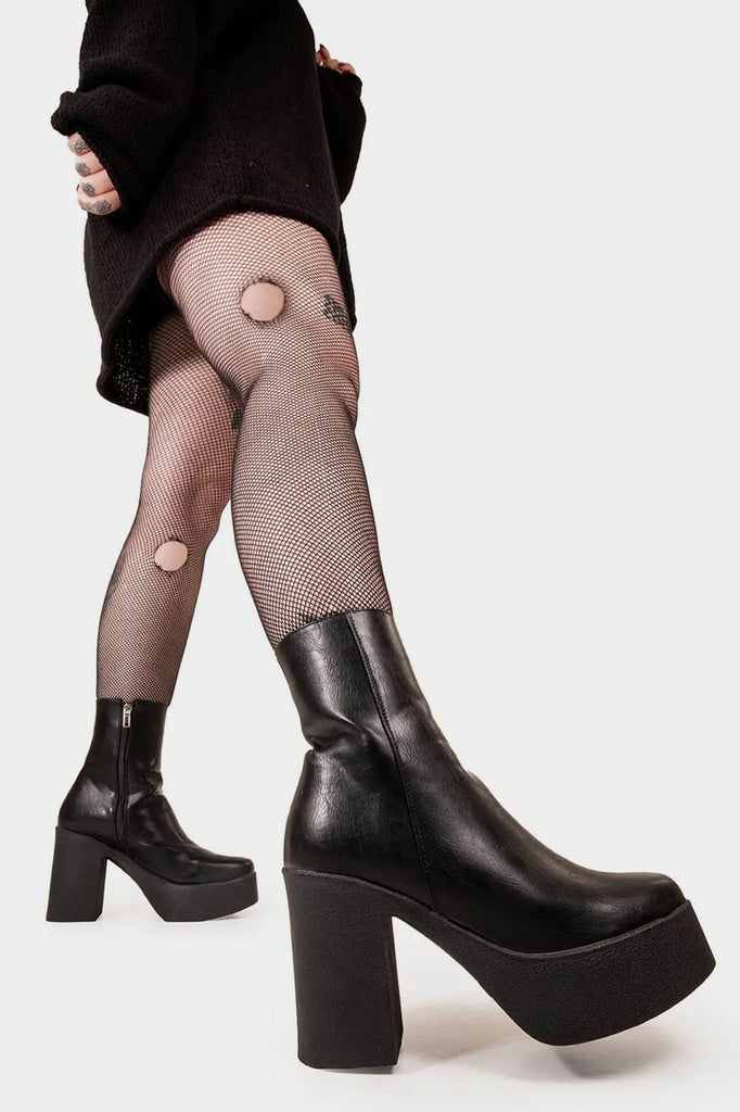 THE TRENDING ONE
 
 My Hero Platform Ankle Boots in Black faux leather. These Black vegan Ankle Boots feature an elegant, minimalist design and a Platform sole and heel, perfect for adding height and style to any outfit. Made with eco-friendly materials and 100% cruelty-free, these boots are as ethical as they are stylish.
 
 
 - Platform Height: 1.25 inch
 - Heel Height: 4 inch
 - Low ankle length
 - Black zipper 
 - Platform sole
 - Square toe 
 - 100% vegan 
 
 SKU: LMF 1211 - BlackPU