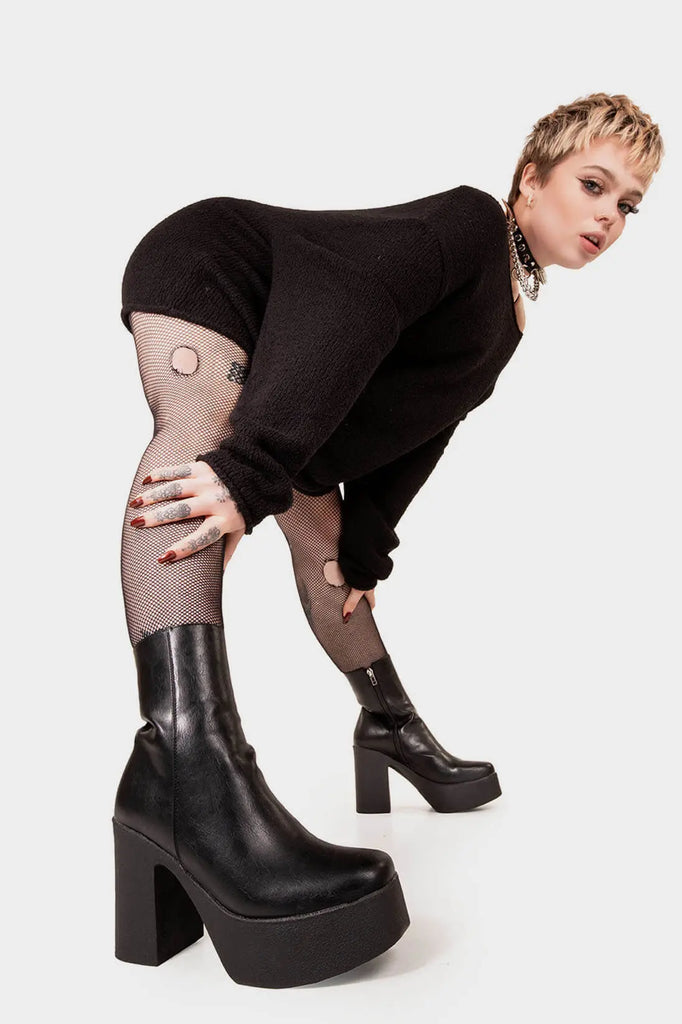 THE TRENDING ONE
 
 My Hero Platform Ankle Boots in Black faux leather. These Black vegan Ankle Boots feature an elegant clutter free design and a Platform sole and heel, perfect for adding height and style to any outfit. Made with eco-friendly materials and 100% cruelty-free, these boots are as ethical as they are stylish.
 
 
 - Platform Height: 1.25 inch
 - Heel Height: 4 inch
 - Low ankle length
 - Black zipper 
 - Platform sole
 - Square toe 
 - 100% vegan 
 
 SKU: LMF 1211 - BlackPU