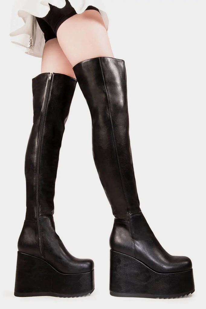 Peak Perfection
 
 Never Again Chunky Platform Thigh High Boot in Black faux leather. These black vegan Platform Boots feature on our chunky platform wedge sole, let the boots do the talking. Made with eco-friendly materials and 100% cruelty-free, these platform boots are as ethical as they are Perfect!
 
 
 - Platform Height
 - Black Zipper
 - Chunky Platform wedge sole
 - Shark's teeth grip
 - Round Toe
 - 100% vegan 
 
 SKU: LMF 2069 - BlackPU