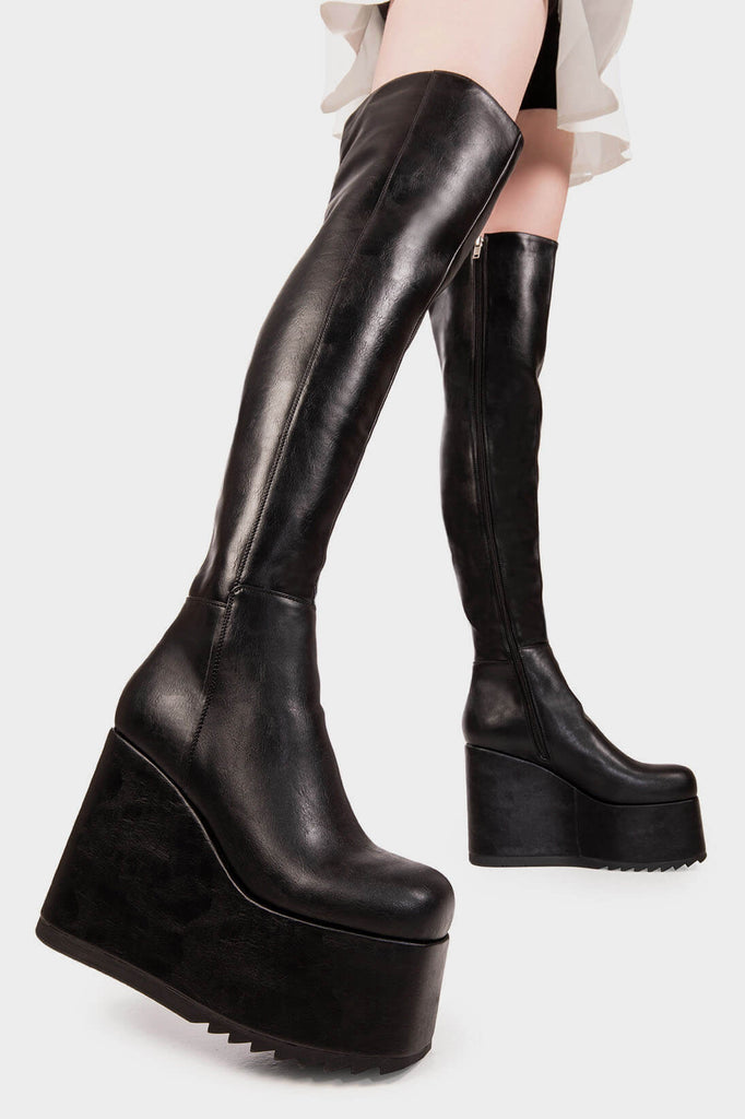 Peak Perfection
 
 Never Again Chunky Platform Thigh High Boot in Black faux leather. These black vegan Platform Boots feature on our chunky platform wedge sole, let the boots do the talking. Made with eco-friendly materials and 100% cruelty-free, these platform boots are as ethical as they are Perfect!
 
 
 - Platform Height: 1.8 inch
 - Heel height: 5.5 inch 
 - Black Zipper
 - Chunky Platform wedge sole
 - Shark's teeth grip
 - Square Toe
 - 100% vegan 
 
 SKU: LMF 2069 - BlackPU