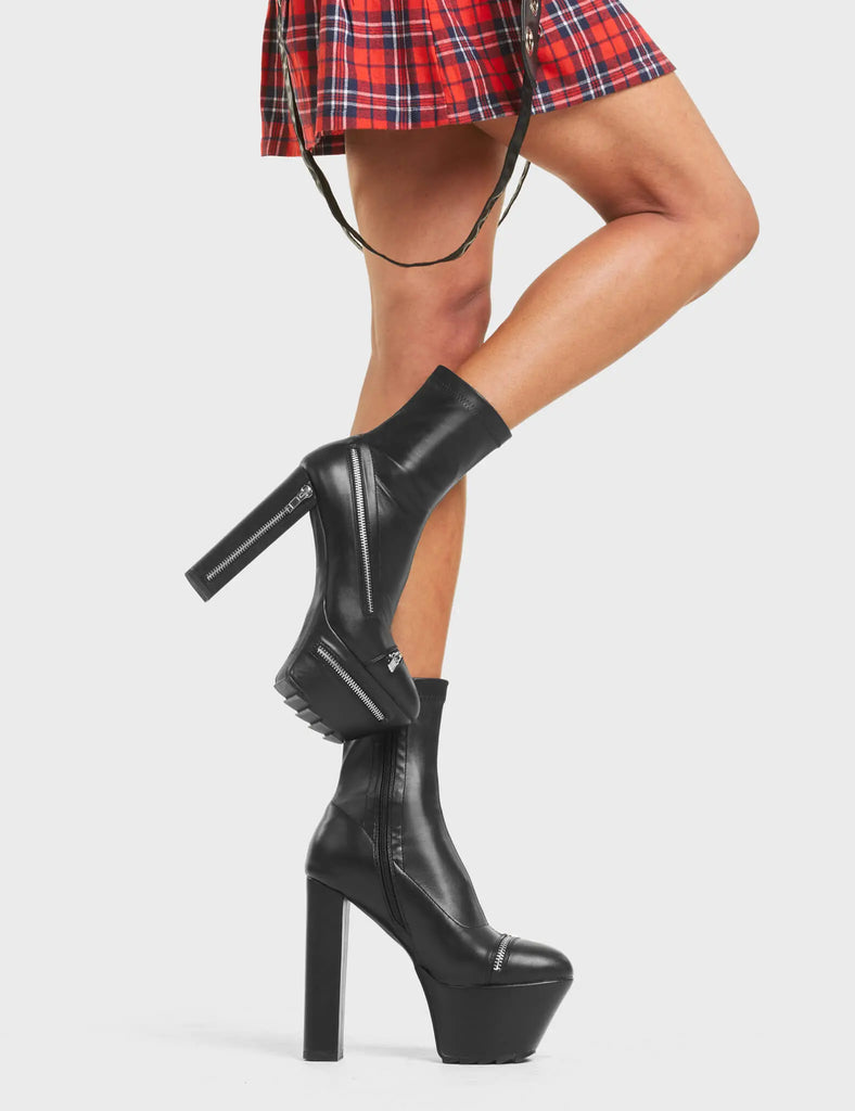 VIGILANTE
 
 No Chance Platform Ankle Boots in Black faux leather. These boots feature an edgy zip design around the boot, with a block heel that also features a zip design. On our platform sole with shark's teeth rubber grip, the perfect way to make everyone stop and stare. Made with eco-friendly materials and 100% cruelty-free.
 
 - Platform Height: 5.5 CM
 - Heel Height: 14 CM
 - Silver Zip design
 - High Heel
 - Platform sole
 - Round toe.
 - 100% vegan
 
 SKU: LMF 4424 - BlackPU