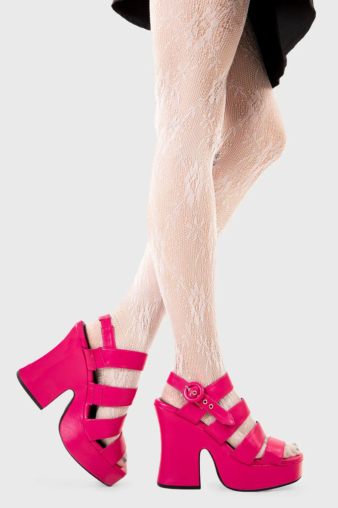 Holiday Mode
 
 Not A Friend Platform Sandals in Fuchsia faux leather. These platform sandals feature three straps across the upper with a adjustable strap across the heel, step into relaxation and comfort. Made with eco-friendly materials and 100% cruelty-free, these platform boots are as ethical as they are COMFORTABLE!
 
 - Platform Height
 - Heel Height
 - Adjustable strap
 - Silver eyelets with 'O'shaped buckle
 - Chunky Platform sole
 - Round Toe 
 - 100% vegan 
 
 SKU: LMF 2510 - FuchsiaPU