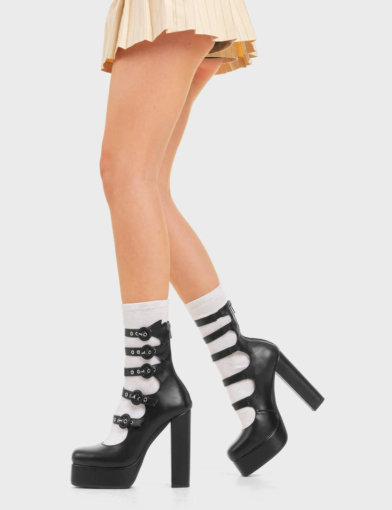 STRAPPED IN 

On Hold Platform Heels in Black Faux Leather. These platform heels feature a multi-strap design with five adjustable straps and buckles. Also features a zip at the back. These are Heels that elevate any outfit. Made with eco-friendly materials and 100% cruelty-free, these platform boots are as ethical as they are trendy.

- Platform Height
- Heel Height
- Multi Strap design
- Five Adjustable strap.
- Five buckles
- Black zip
- High Heel
- Platform sole
- 100% vegan

SKU:LMF 3801 - BlackPU