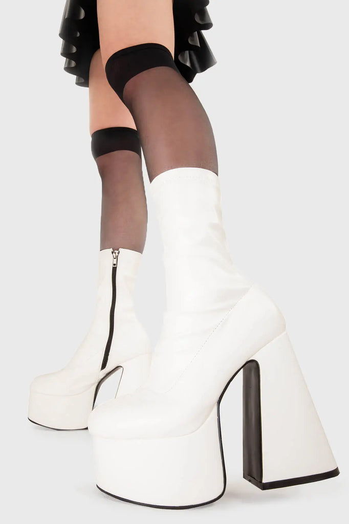 ON THE CATWALK
 
 Over It Platform Ankle Boots in White fitting faux leather. These platform boots feature a minimalist look with a flared heel, keeping it nice and classy. Made with eco-friendly materials and 100% cruelty-free, these platform boots are as ethical as they are chic.
 
 - Platform Height
 - Ankle length
 - Fitted feel
 - Flared heel
 - High Heel
 - 100% vegan 
 
 SKU: LMF 3350 - WhiteStretchPU