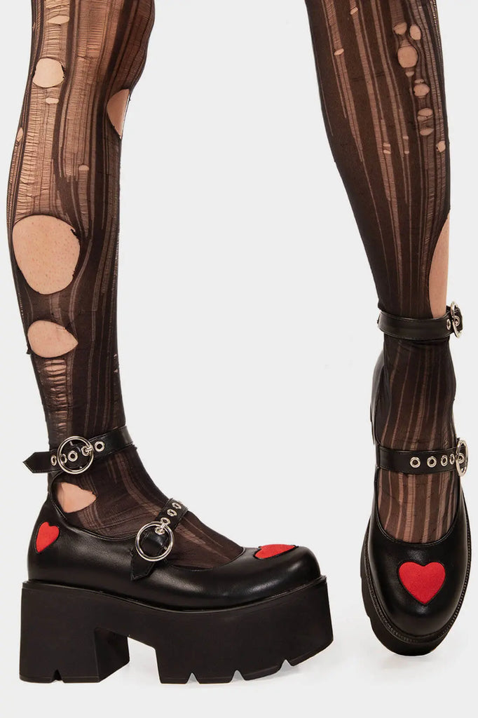 THE ICON
 
 Rosey Love Chunky Mary Jane Shoes in Black Faux Leather. These Mary Janes feature a Red faux suede hearts on a Chunky and comfortable Platform sole. Everyone needs a pairs of Mary Janes! Made with eco-friendly materials and 100% cruelty-free, these Mary Janes are as ethical as they are cute!
 
 
 - Platform Height: 3 inch
 - T Bar structure
 - Red Hearts
 - O shaped buckles and silver eyelets
 - Chunky Platform sole
 - Round toe 
 - 100% vegan 
 
 SKU: LMS 449 - BlackPU/Red