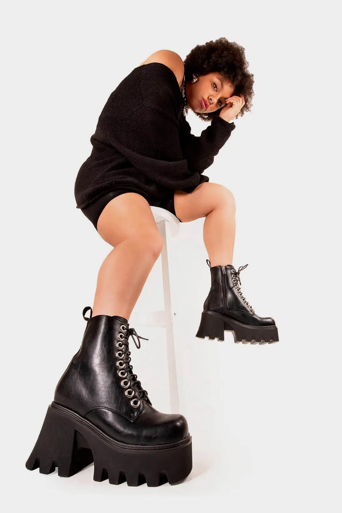 TAKE ON THE WORLD
 
 Run To You Chunky Platform Ankle Boots in Black Patent. These vegan Boots feature a CHUNKY Platform sole and large O shaped eyelets, perfect for adding height and edge to any outfit. Made with eco-friendly materials and 100% cruelty-free, these Boots are as ethical as they are hot!
 
 
 - Platform Height: 3.3 inch
 - Black zipper
 - Lace up
 - O shaped buckle and silver eyelets
 - CHUNKY Platform sole
 - Square toe 
 - 100% vegan 
 
 SKU: LMF 1370 - BlackPU