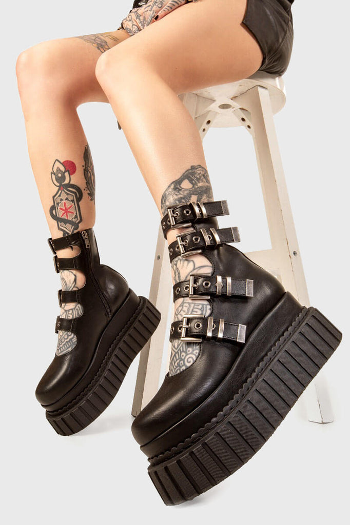 Punk Princess
 
 Same Crew Chunky Ankle Creeper Boots in black faux leather. These black Creeper Boots feature four straps across the upper and ankle with silver square shaped buckles and silver eyelets, perfect combination of stylish and comfortable. Made with eco-friendly materials and 100% cruelty-free, these platform boots are as ethical as they are Comfortable!
 
 - Platform Height
 - Four black stras
 - Silver eyelets and square shaped buckles
 - Chunky creeper sole
 - Round Toe 
 - 100% vegan
