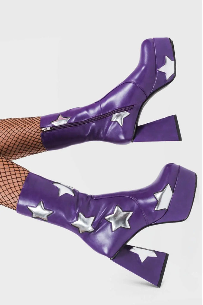 DISCO FEVER 
 
 Seeking Stars Platform Ankle Boots in Purple faux leather. These platform boots feature a purple boot with silver stars all over. Made with eco-friendly materials and 100% cruelty-free, these platform boots are as ethical as they are chic.
 
 - Platform Height
 - Silver stars
 - Calf length
 - Triangle heel
 - High Heel
 - 100% vegan 
 
 SKU: LMF 3338 - PurplePU/SilverStar