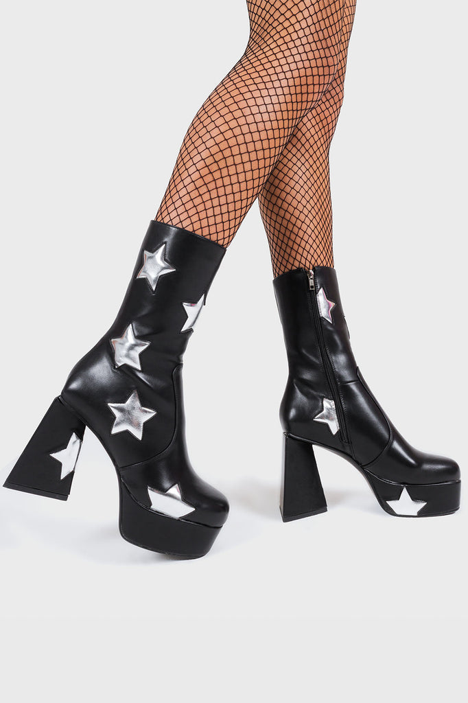 DISCO FEVER 
 
 Seeking Stars Platform Ankle Boots in Black faux leather. These platform boots feature a black boot with silver stars all over. Made with eco-friendly materials and 100% cruelty-free, these platform boots are as ethical as they are chic.
 
 - Platform Height
 - Silver stars
 - Calf length
 - Triangle heel
 - High Heel
 - 100% vegan 
 
 SKU: LMF 3338 - BlackPU/SilverStar