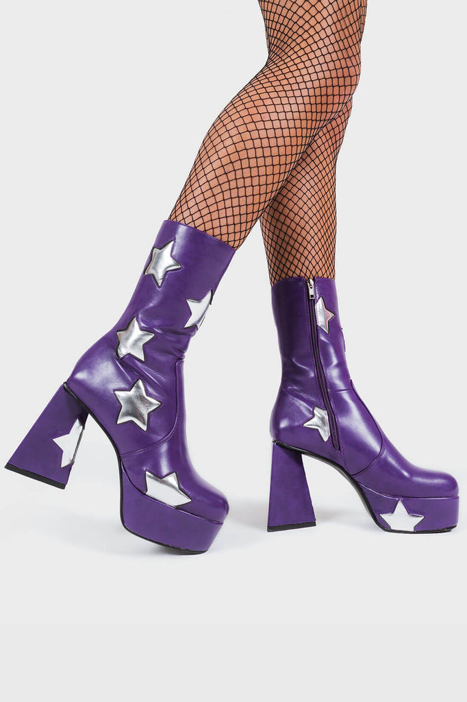 DISCO FEVER 
 
 Seeking Stars Platform Ankle Boots in Purple faux leather. These platform boots feature a purple boot with silver stars all over. Made with eco-friendly materials and 100% cruelty-free, these platform boots are as ethical as they are chic.
 
 - Platform Height
 - Silver stars
 - Calf length
 - Triangle heel
 - High Heel
 - 100% vegan 
 
 SKU: LMF 3338 - PurplePU/SilverStar