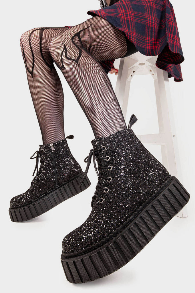 Twinkle Toes
  
 Shooting Star Chunky Ankle Creeper Boot in Black Glitter. These black vegan Platform Boots feature our iconic glitter detail througout with adjustable lace up detail, sparkle with every step! Made with eco-friendly materials and 100% cruelty-free, these platform boots are as ethical as they are glowing!
 
 
 - Platform Height: 2.3 inch
 - Black zipper 
 - Black laces and silver eyelets 
 - Chunky Creeper sole
 - Round Toe
 - 100% vegan 
 
 SKU: LMF 2007 - BlackGlitter
