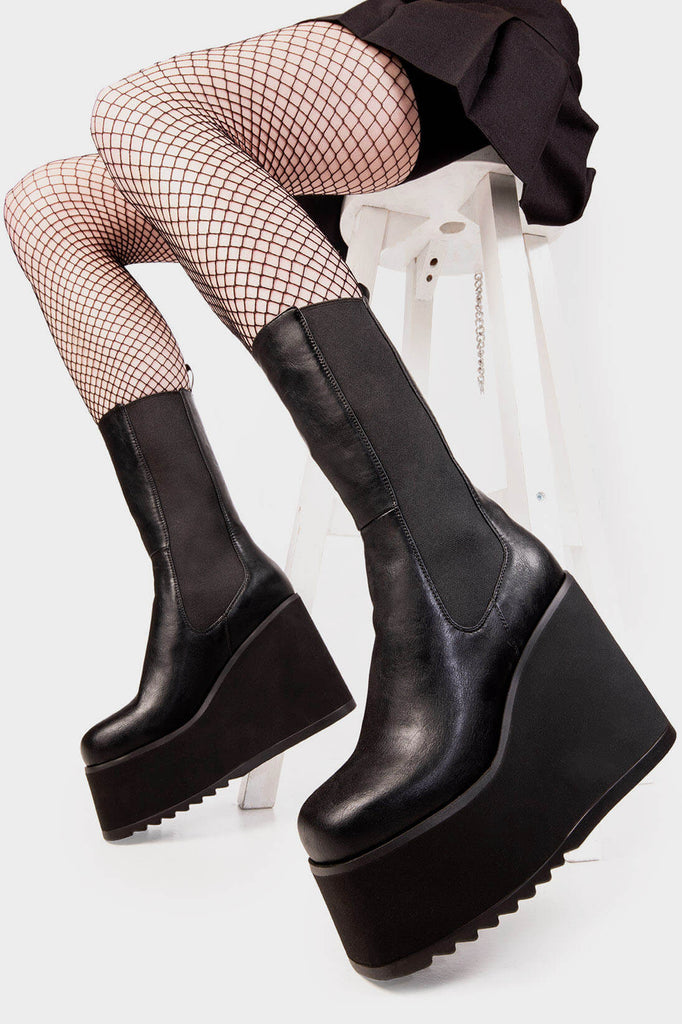 Savage stompers
 
 Shy Love Chunky Platform Calf Boots. These black vegan Platform Boots feature on our chunky platform sole with a stretchy gusset detail, perfect for any occasion. Made with eco-friendly materials and 100% cruelty-free, these platform boots are as ethical as they are Savage!
 
 
 - Platform Height: 1.8 inch
 - Heel Height: 5.5 inch
 - Gusset detail 
 - Wide calf and ankle friendly 
 - Platform Sole 
 - Square Toe
 - 100% vegan 
 
 SKU: LMF 2022 - BlackPU