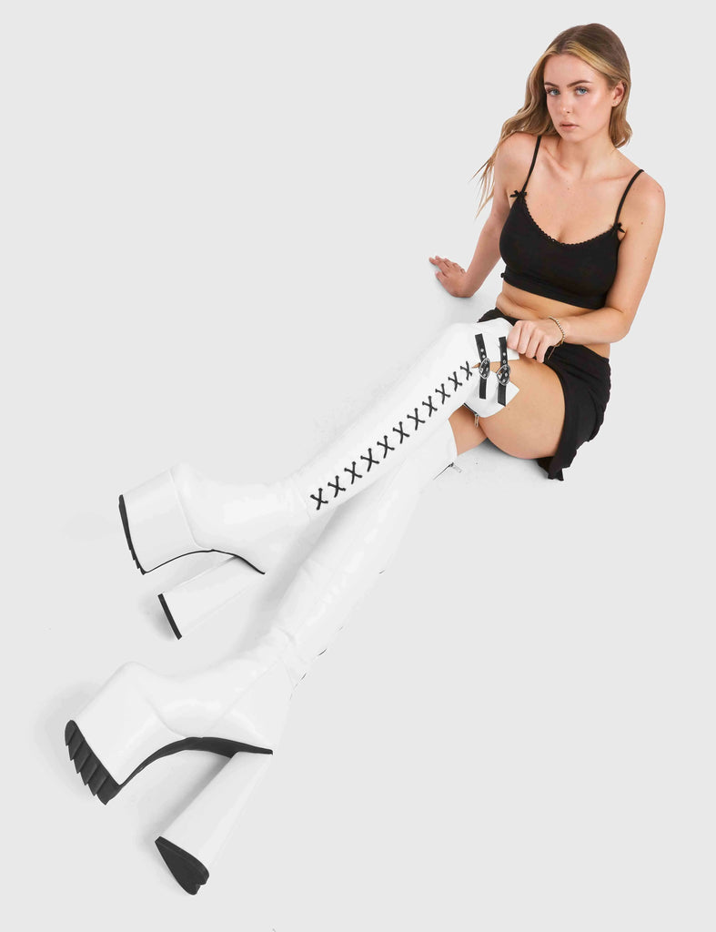 DONT STOP

Small Victories Platform Thigh High Boots in White faux leather. These platform boots feature a heart shaped heel and a black heart at the bottom. The boots also feature black lace detailing across the side of the boot. Also features two adjustable straps with silver eyelets and heart shaped buckles. 100% vegan 

- Platform Height
- Knee High Length
- Heart Heel
- Black Heart
- Silver Eyelets
- Heart Buckles
- Adjustable Straps
- Black Lace Detail
- 100% Vegan

SKU: LMF 4910 - WhitePU