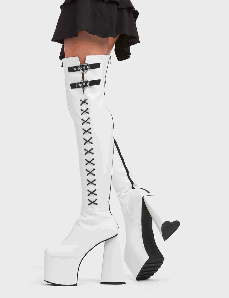 DONT STOP

Small Victories Platform Thigh High Boots in White faux leather. These platform boots feature a heart shaped heel and a black heart at the bottom. The boots also feature black lace detailing across the side of the boot. Also features two adjustable straps with silver eyelets and heart shaped buckles. 100% vegan 

- Platform Height
- Knee High Length
- Heart Heel
- Black Heart
- Silver Eyelets
- Heart Buckles
- Adjustable Straps
- Black Lace Detail
- 100% Vegan

SKU: LMF 4910 - WhitePU