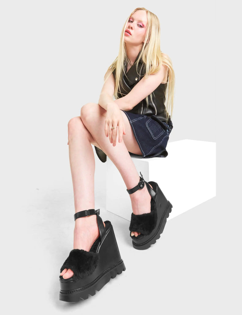 2 AM
 
 Softie Chunky Platform Sandals in Black faux leather. These sandals feature an adjustable ankle strap with silver eyelets and 'O' ring buckles. Proudly features a fur detail across the upper. Made with eco-friendly materials and 100% cruelty-free, these platform boots are as ethical as they are Charming.
 
 - Platform Height
 - Heel Height
 - Adjustable Black Strap
 - Silver Eyelets 
 - 'O' ring buckle
 - Chunky Platform Sole
 - Open Toe
 - 100% vegan
 
 SKU: LMF 4884 - BlackPU/FUR