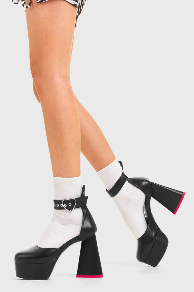 IN MY HEART AND MIND
 
 Sole Mate Platform Heels in Black faux leather. These platform boots feature a sliver heart buckle and a heart shaped heel, keeping it nice and classy. Made with eco-friendly materials and 100% cruelty-free, these platform boots are as ethical as they are chic.
 
 - Platform Height
 - Silver heart buckle
 - Adjustable straps
 - Pink sole
 - Shark teeth grip
 - heart shaped heel
 - High Heel
 - 100% vegan 
 
 SKU: LMF 3475 - BlackPU