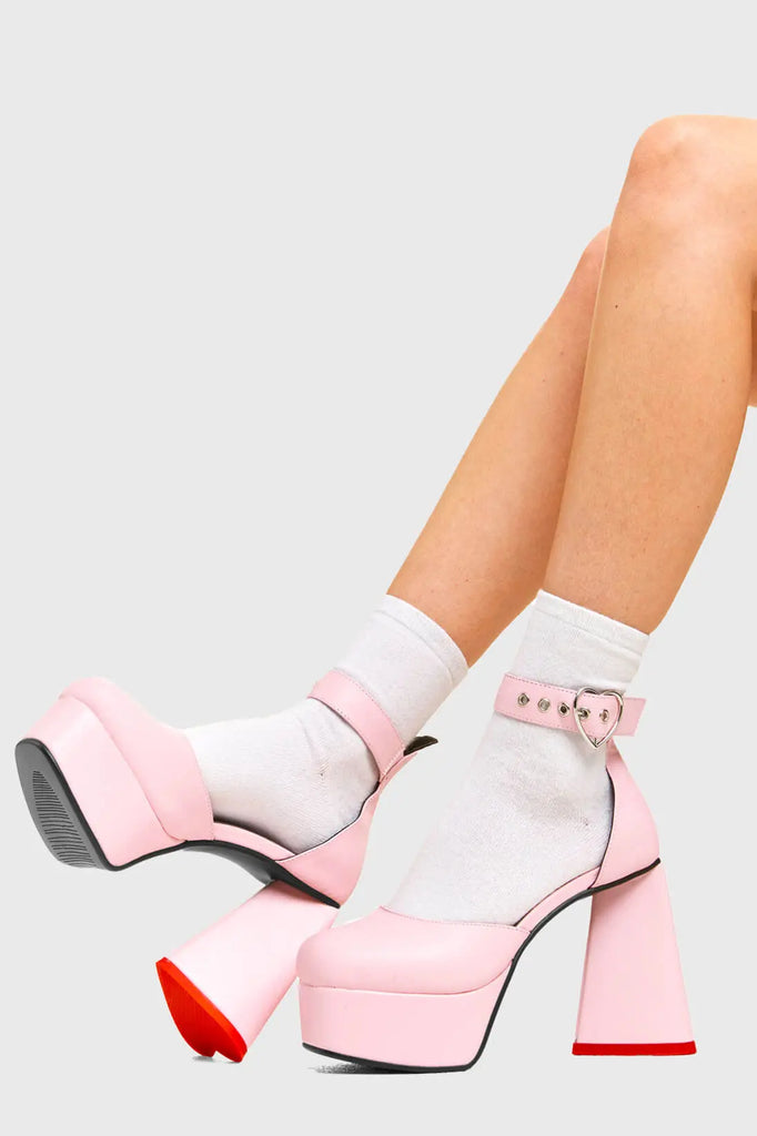 IN MY HEART AND MIND
 
 Sole Mate Platform Heels in Pink faux leather. These platform boots feature a sliver heart buckle and a heart shaped heel, keeping it nice and classy. Made with eco-friendly materials and 100% cruelty-free, these platform boots are as ethical as they are chic.
 
 - Platform Height
 - Silver heart buckle
 - Adjustable straps
 - Pink sole
 - Shark teeth grip
 - heart shaped heel
 - High Heel
 - 100% vegan 
 
 SKU: LMF 3475 - PinkPU