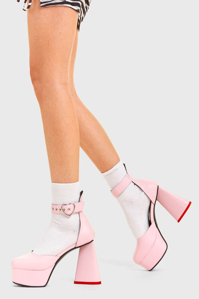 IN MY HEART AND MIND
 
 Sole Mate Platform Heels in Pink faux leather. These platform boots feature a sliver heart buckle and a heart shaped heel, keeping it nice and classy. Made with eco-friendly materials and 100% cruelty-free, these platform boots are as ethical as they are chic.
 
 - Platform Height
 - Silver heart buckle
 - Adjustable straps
 - Pink sole
 - Shark teeth grip
 - heart shaped heel
 - High Heel
 - 100% vegan 
 
 SKU: LMF 3475 - PinkPU