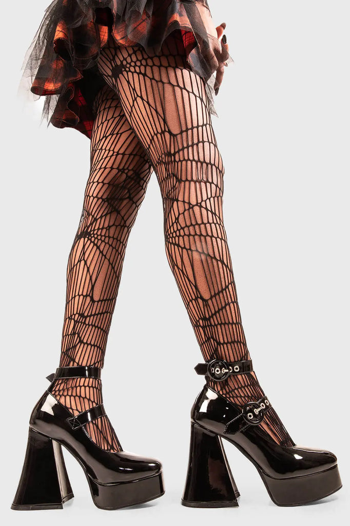 Saucy Steps 

Spoil Me Platform Heels in Black Patent faux leather. These vegan Platform Heels feature two adjustable black patent ankle straps with ""O"" ring buckles and silver eyelets, making a statment with every step. Made with eco-friendly materials and 100% cruelty-free, these heels are as ethical as they are fabulous!

- Platform Height: 2.6 inch
- Heel Height: 5.5 inch
- Two adjustable black patent straps
- Silver eyelets
- "O" ring buckles
- Platform sole
- Flared heel
- Round toe
- 100% vegan
