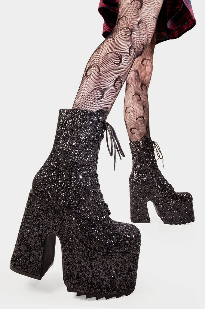 Dazzling Delights
 
Spotlight Chunky Platform Ankle Creeper Boot in Black Glitter. These black vegan Platform Boots feature our iconic glitter detail througout with adjustable lace up detail, shiny perfection to glow with every step. Made with eco-friendly materials and 100% cruelty-free.


- Platform Height: 2.3 inch
- Heel Height: 5.5 inch
- Black zipper 
- Black laces and silver eyelets 
- Chunky Creeper sole
- Round Toe
- 100% vegan 

SKU: LMF 2046 - BlackGlitter