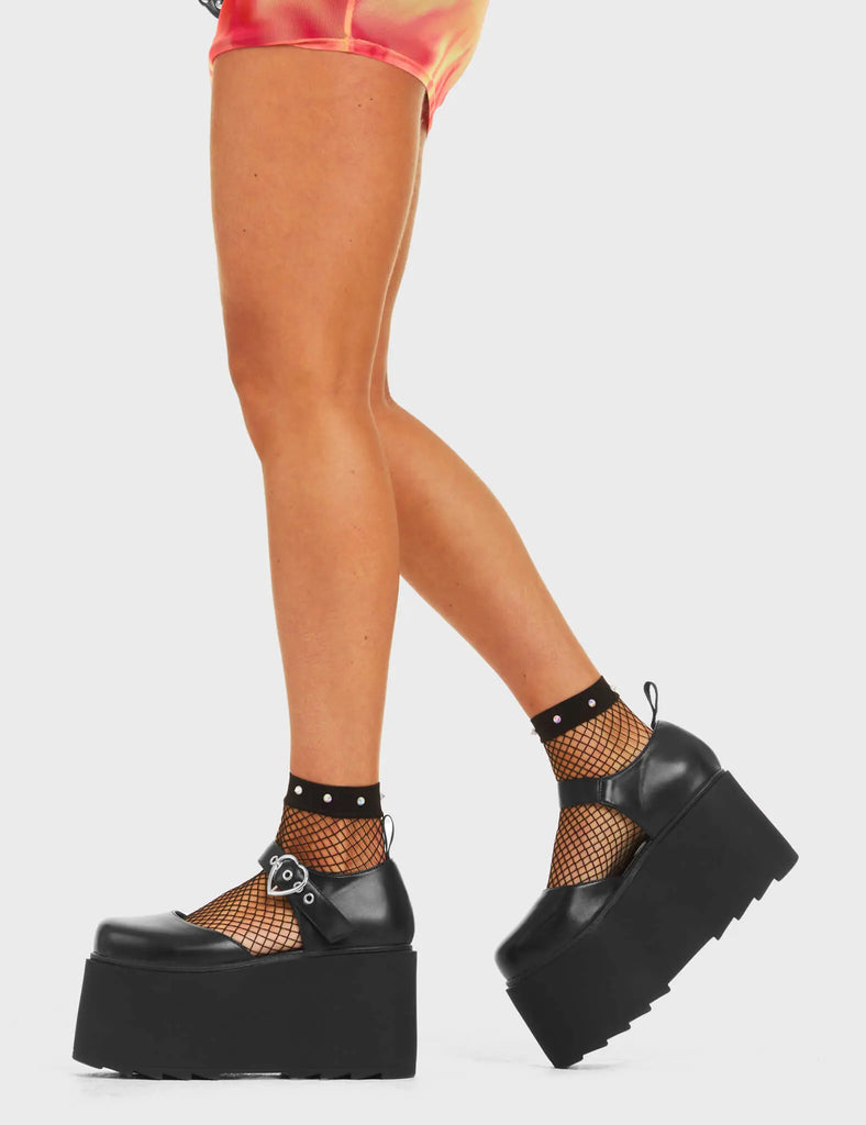 Step Out in Fashion
 
 Stay Together Chunky Platform Shoes in Black faux leather. These flatform shoes feature a adjustable strap with a silver heart shaped buckle and silver eyelets. Made with eco-friendly materials and 100% cruelty-free, these platform shoes are as ethical as they are Edgy
 
 - Platform Height
 - Adjustable strap
 - Silver Heartshaped buckle
 - Silver Eyelets 
 - Flatform Sole
 - Shark's Teeth Grip
 - 100% vegan
 
 SKU: LMF 4547 - BlackPU