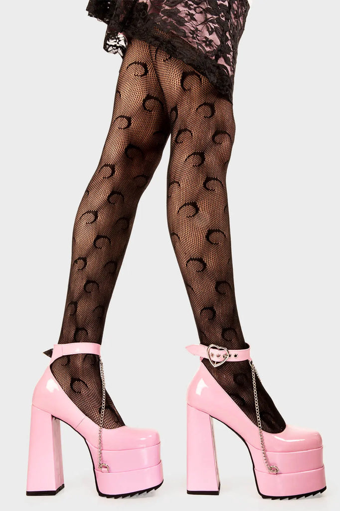 Sweetheart Soles
  
 Sweetheart Platform Heels in Pink Patent faux leather. These pink vegan Platform Heels feature on our double stack platform sole with a pink ankle strap and a heart shaped buckle including a silver chain handing from the ankle strap, setting trends one step at a time. 
 
 
 - Platform Height
 - Heel Height 
 - Heart shaped buckle
 - Pink strap with silver eyelets
 - Shark's teeth rubber grip 
 - Chunky platform sole
 - Square Toe
 - 100% vegan 
 
 SKU: LMF 2091 - PinkPAT