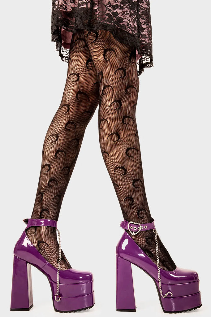 Sweetheart Soles
  
 Sweetheart Platform Heels inPurple Patent faux leather. These purple vegan Platform Heels feature on our double stack platform sole with a purple ankle strap and a heart shaped buckle including a silver chain handing from the ankle strap, setting trends one step at a time.
 
 
 - Platform Height
 - Heel Height 
 - Heart shaped buckle
 - Purple strap with silver eyelets
 - Shark's teeth rubber grip 
 - Chunky platform sole
 - Square Toe
 - 100% vegan 
 
 SKU: LMF 2091 - PurplePAT