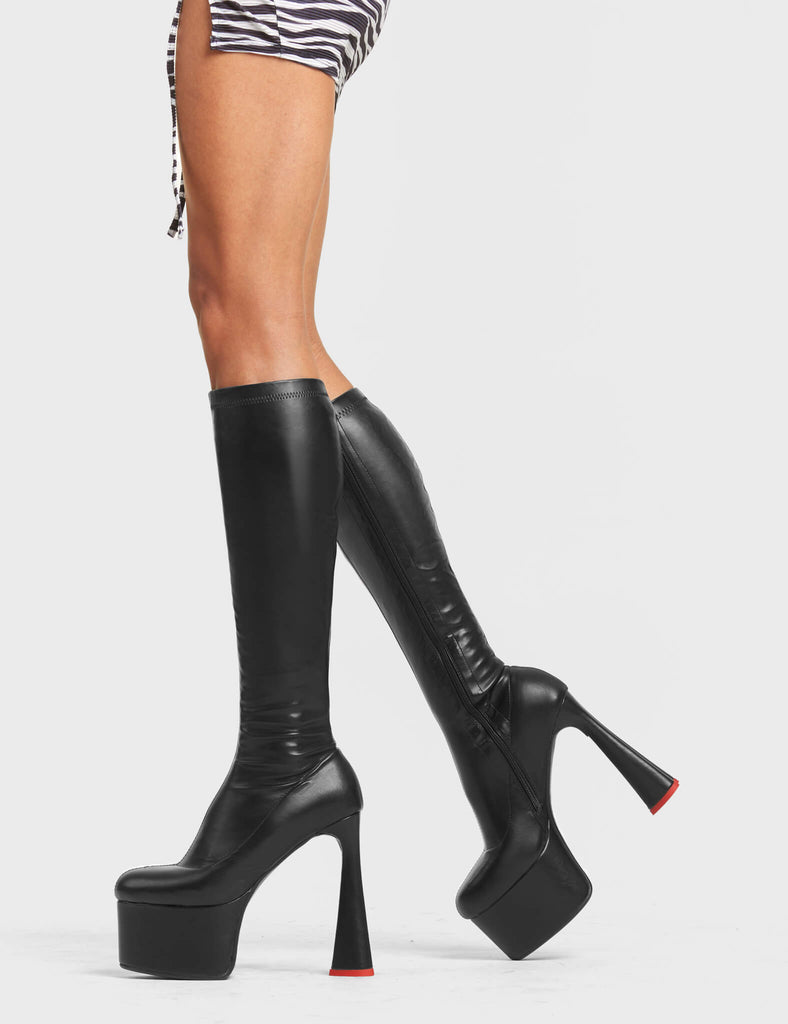 FOREVER TOGETHER
 
 Talk Platform Knee High Boots in Black Stretch faux leather. These platform boots feature on our platform sole and highlights our heart shaped heel with a red heart at the bottom. Made with eco-friendly materials and 100% cruelty-free, these platform boots are as ethical as they are Legendary!
 
 - Platform Height
 - Heel Height
 - Black Zip
 - Knee High Length
 - Stretch Upper
 - Platform Sole
 - Heart Heel
 - Heart Detail
 - Round Toe
 - 100% vegan
 
 SKU: LMF 4471 - BlackPU