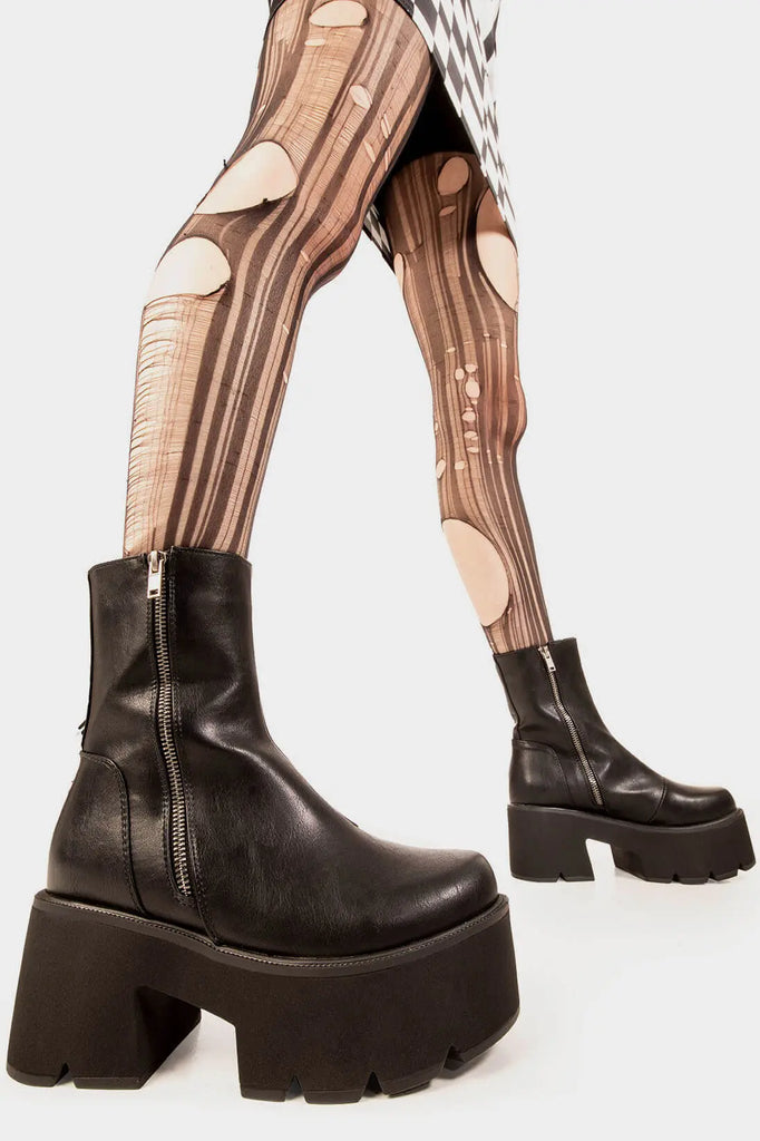 Trendsetter 
 
 Tell Me Lies Chunky Platform Boots. These black vegan Platform Boots feature on our chunky platform sole, comfortable , classic and all round confident. Made with eco-friendly materials and 100% cruelty-free, these platform boots are as ethical as they are cute!
 
 
 - Platform Height: 3 inch
 - Silver zipper 
 - Chunky Platform sole
 - Round Toe
 - 100% vegan 
 
 SKU: LMF 1845 - BlackPU
