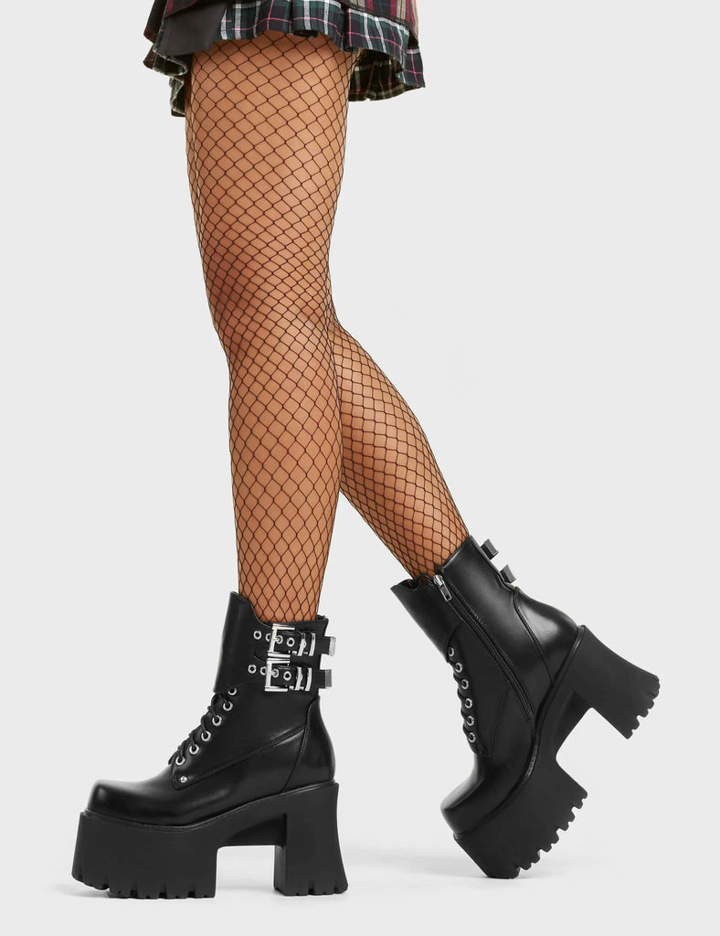 DREAMS
 
 Thinking Spot Chunky Platform Ankle Boots in black faux leather. These black vegan platform boots feature lace up design with a adjustable faux leather flap that includes silver eyelets and two adjustable straps alongside two square shaped buckles, On our rubber grip, chunky platform sole, these platform boots are as ethical as they are perfect!
 
 
 - Platform Height:
 - Black Zipper
 - Lace Up
 - Silver Eyelets
 - Silver Buckles
 - Chunky Platform Sole
 - 100% vegan
 
 SKU: LMF 4108 - BlackPU