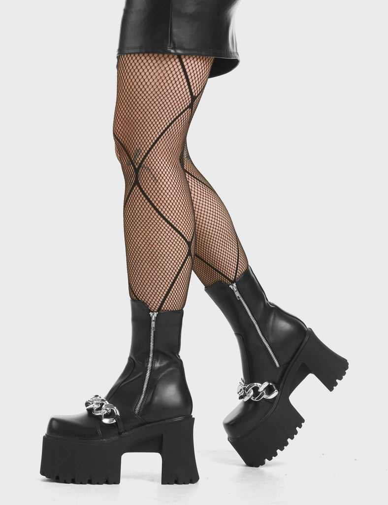 Transmission Chunky Platform Ankle Boots in Black. Feature an external silver zip and a silver chain over the foot.