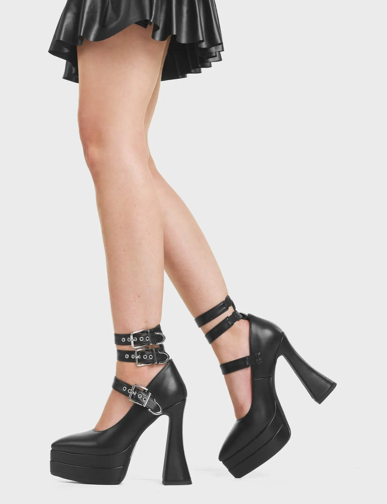 Trust Me Platform Heels feature three square shaped buckles with three adjustable straps and a flared heel