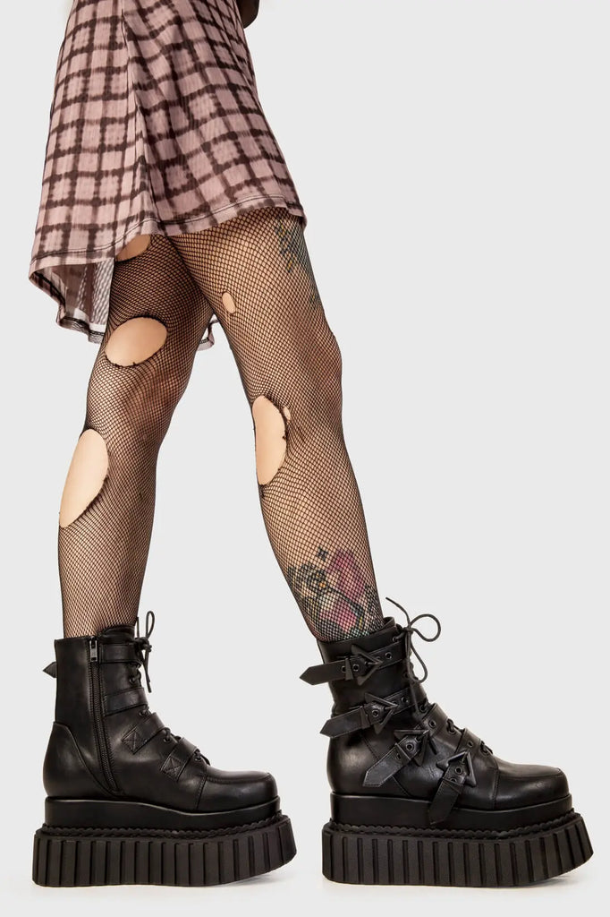 Solid Stompers

Unstable Chunky Ankle Creeper Boots in black faux leather. These black Creeper Boots feature four adjustable black straps with triangular shaped buckles with black lace up detail, let the boots do the talking. Made with eco-friendly materials and 100% cruelty-free, these platform boots are as ethical as they are BOLD!

- Platform Height
- Four black straps
- Black laces
- Black eyelets and triangular shaped buckles
- Chunky creeper sole
- Round Toe 
- 100% vegan 

SKU: LMF 2183 - BlackPU