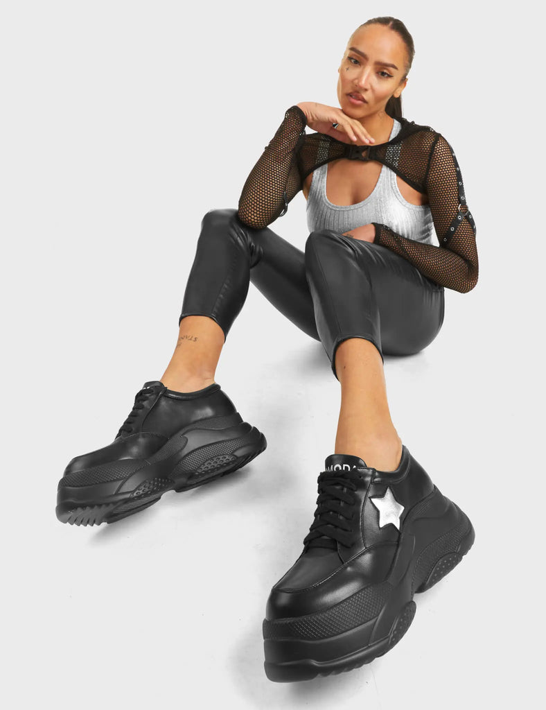 Venus Chunky Platform Sneakers in Black. Feature black lace-up fastening and a silver star.