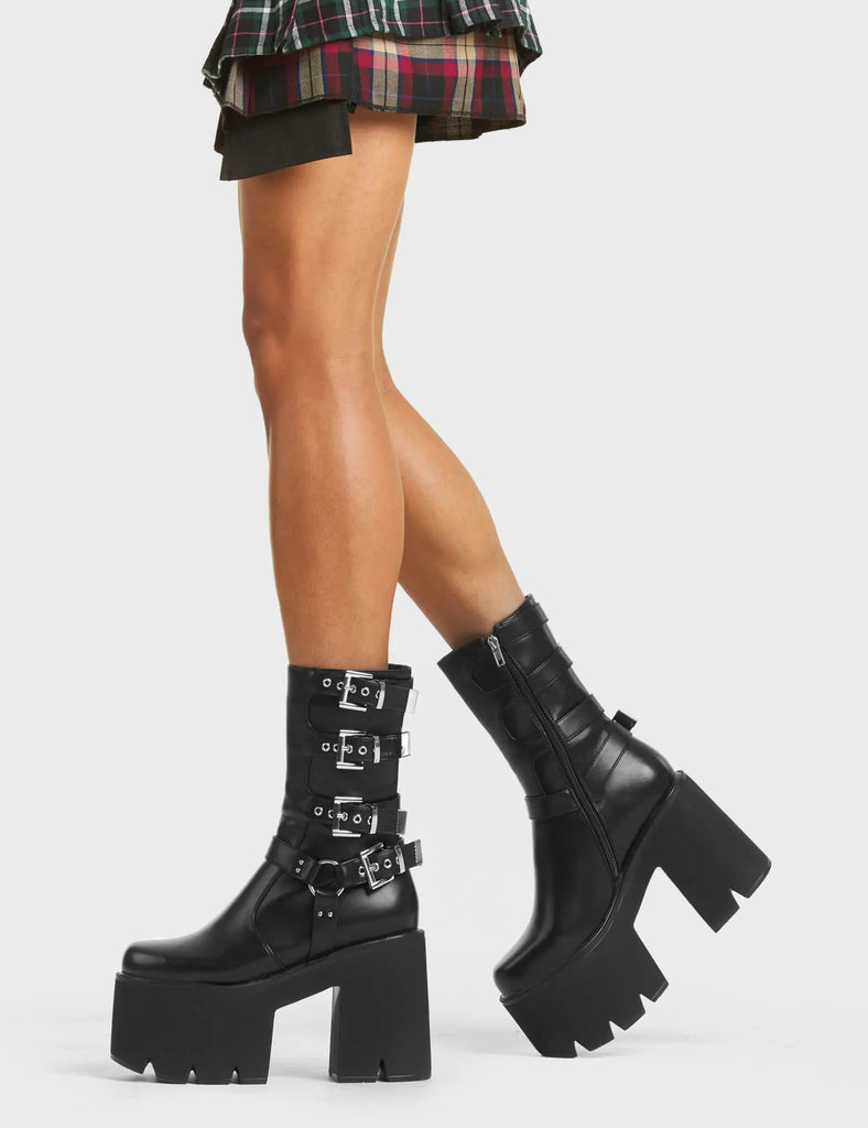 NOTHING BUT VIBES
 
 Vibetech Chunky Platform Ankle Boots in Black faux leather. These Platform Ankle Boots feature four adjustable straps with silver buckles on a chunky and comfortable platform sole. Made with eco-friendly materials and 100% cruelty-free, these Ankle Boots are as ethical as they are badass!
 
 
 - Platform Height:
 - Square Buckles
 - Silver Eyelets
 - Chunky Platform Sole
 - Black zipper
 - 'O' Rng Detail
 - 100% vegan
 
 SKU: LMF 5016 - BlackPU