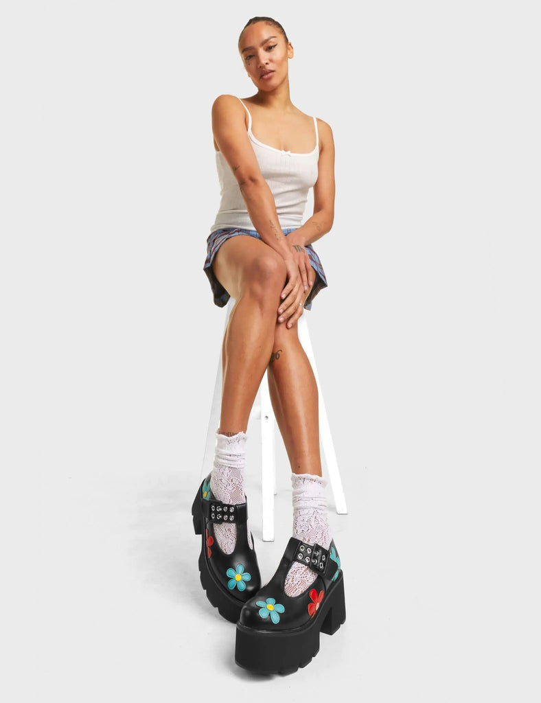 Watch Me Chunky Mary Jane Shoes in Black faux leather. Features multi-coloured flowers, on a chunky and comfortable platform sole.