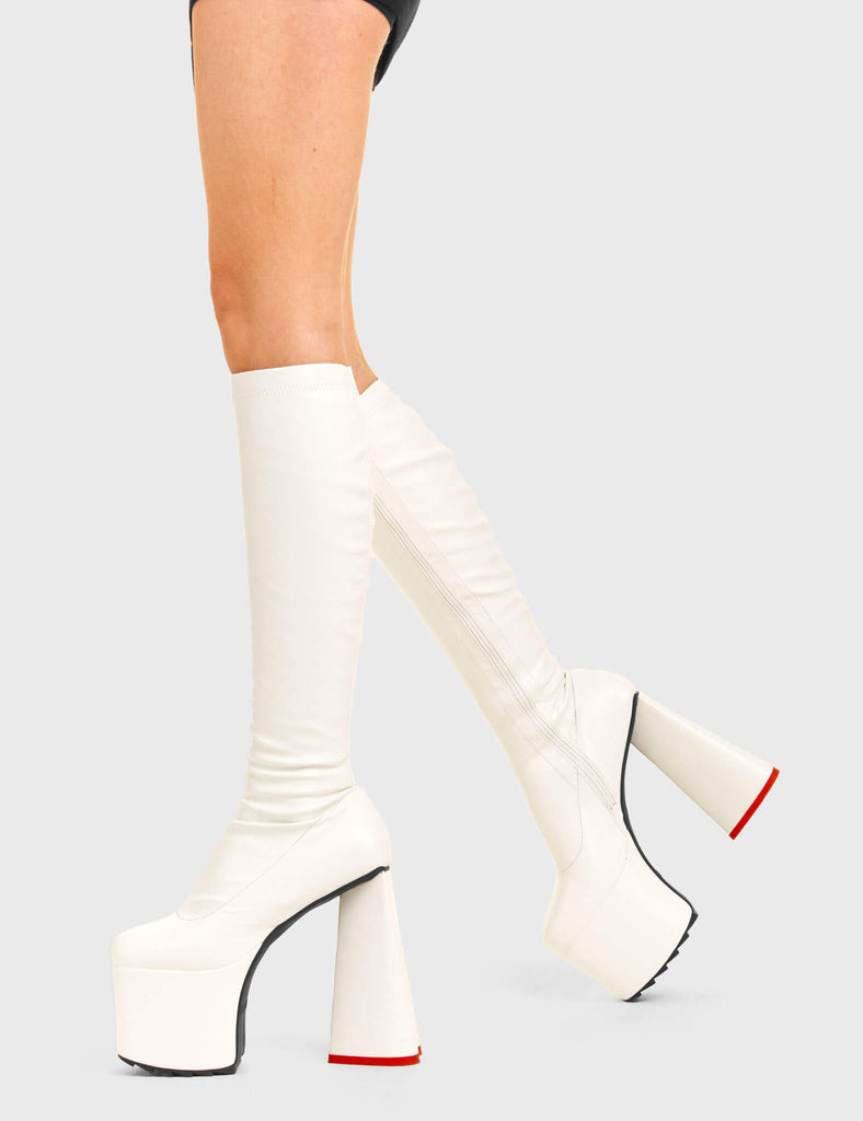 PEACE AND LOVE
 
 Wild Child Platform Knee High Boots in White Fitted Faux Leather. These vegan western Boots feature heart shaped heel, with a red sole and shark teeth grips, very classy. Made with eco-friendly materials and 100% cruelty-free, these boots are as ethical as they are edgy!
 
  
 - Chunky Platform heels
 - Knee length
 - Shark teeth grip
 - Fitted feel
 - Heart shaped heel
 - Red heel sole
 - Rounded toe 
 - 100% vegan 
 
 SKU: LMF 3633 - BlackStretchPU