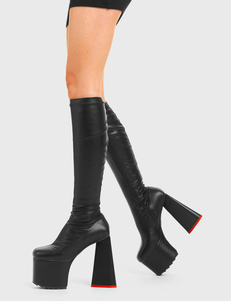 PEACE AND LOVE
 
 Wild Child Platform Knee High Boots in Black Fitted Faux Leather. These vegan western Boots feature heart shaped heel, with a red sole and shark teeth grips, very classy. Made with eco-friendly materials and 100% cruelty-free, these boots are as ethical as they are edgy!
 
  
 - Chunky Platform heels
 - Knee length
 - Shark teeth grip
 - Fitted feel
 - Heart shaped heel
 - Red heel sole
 - Rounded toe 
 - 100% vegan 
 
 SKU: LMF 3633 - BlackStretchPU